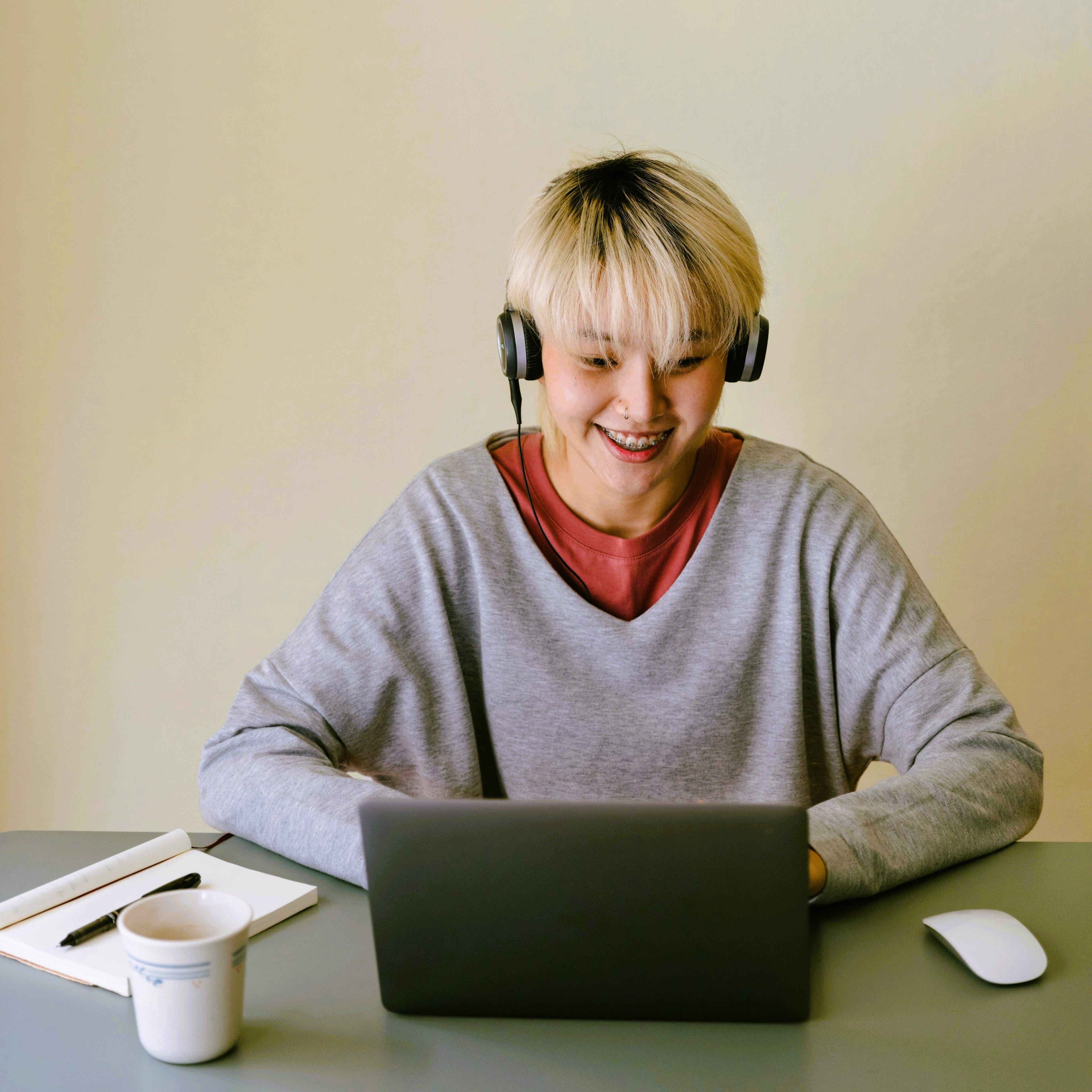happy person looking at computer screen, enjoying a sale!