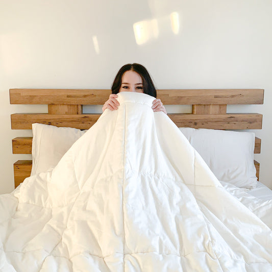 woman-in-bed-happy-comfy-wish-to-stay-in-bed-all-creamy-white-color-of-kapok-bamboo-hemp