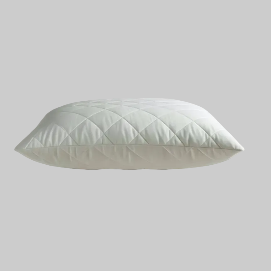 white quilted kapok latex wool pillow on pale grey background